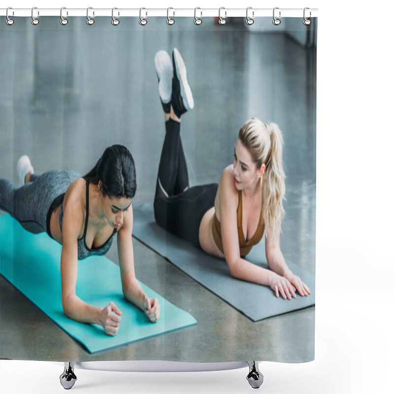 Personality  Blonde Girl Lying On Yoga Mat And Looking At African American Sportswoman Doing Plank Exercise In Gym Shower Curtains