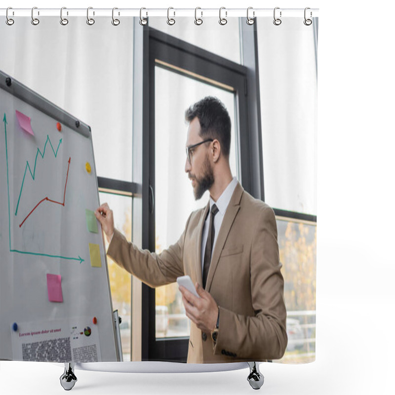 Personality  Concentrated Bearded Corporate Manager In Stylish Blazer And Eyeglasses Holding Smartphone And Working Near Flip Chart And Large Windows In Modern Office Shower Curtains