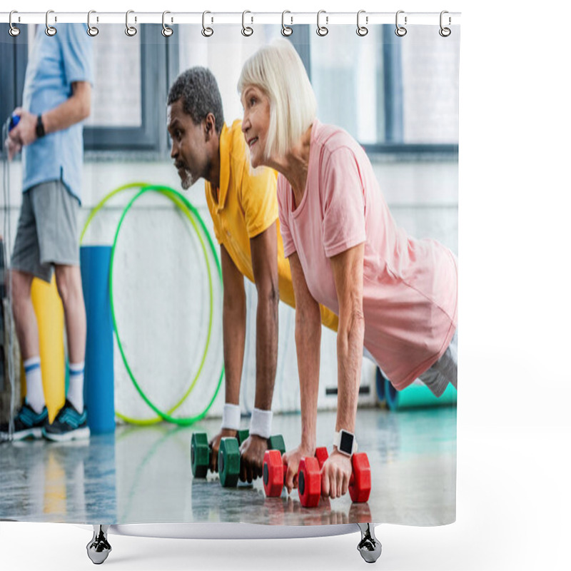 Personality  Side View Of Interracial Mature Couple Doing Plank With Dumbbells At Gym Shower Curtains