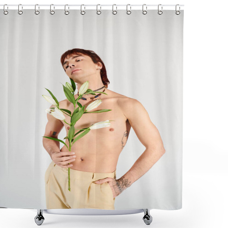 Personality  A Young Man Confidently Holding A Delicate Flower In A Studio With A Grey Backdrop, Exuding A Sense Of Intimacy And Beauty. Shower Curtains