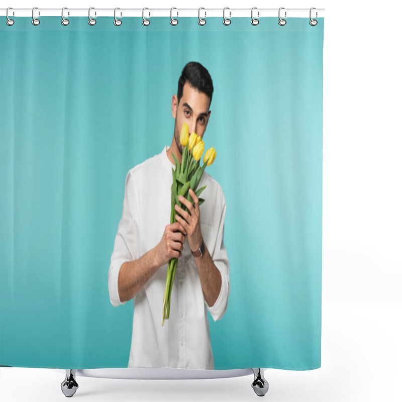 Personality  Young Arabian Man In White Shirt Holding Yellow Flowers Isolated On Blue  Shower Curtains