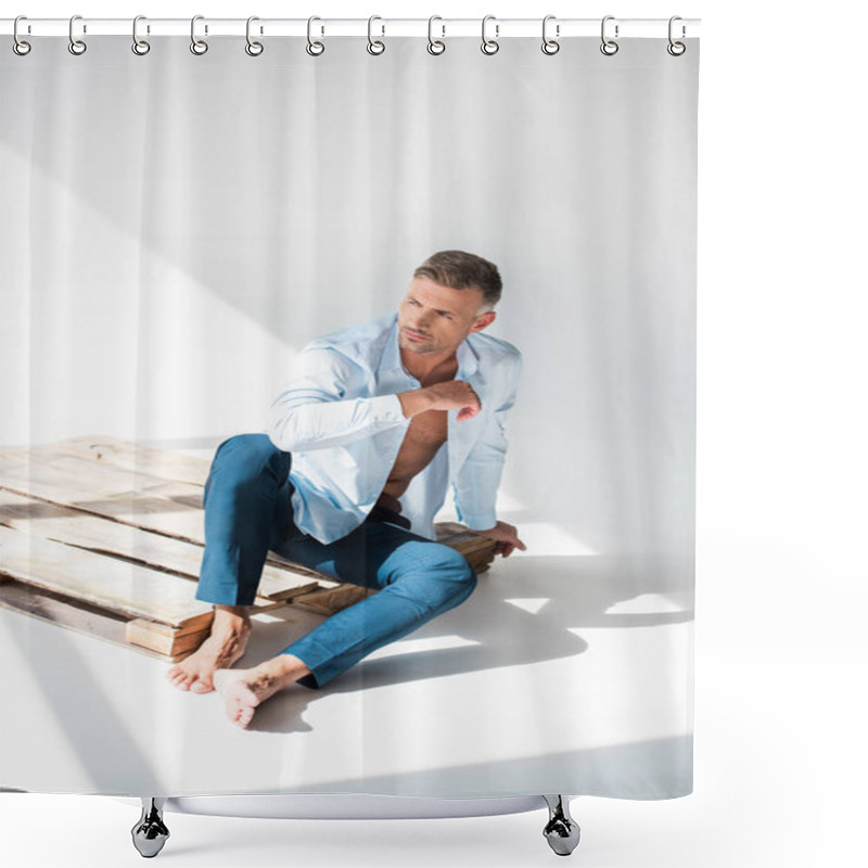 Personality  Sexy Macho Sitting On Wooden Pallet On White And Looking Away Shower Curtains