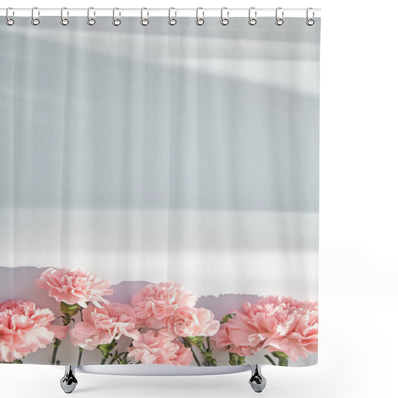 Personality  Top View Of Pink Carnations On White Background With Sunlight And Shadows Shower Curtains