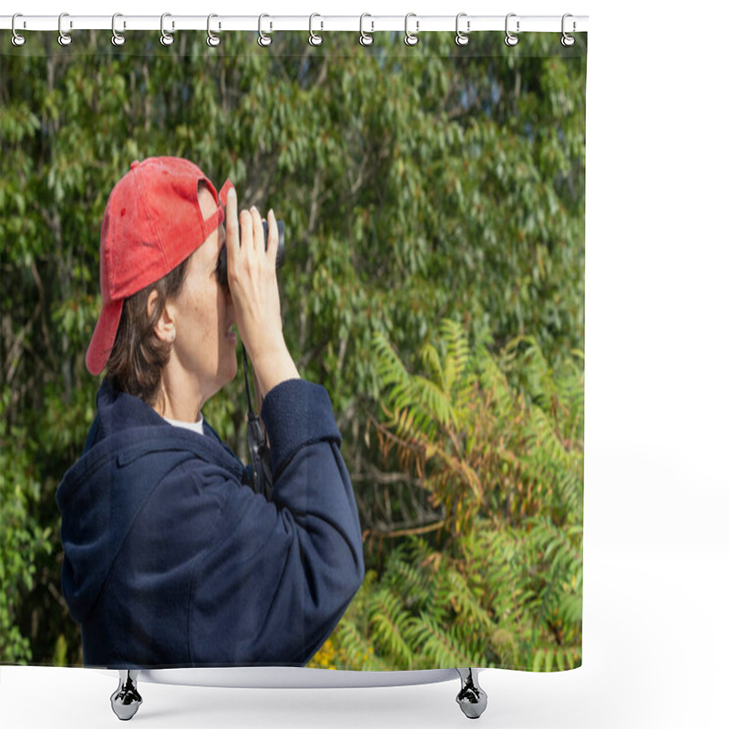 Personality  Middle-aged Woman Looking Through Binoculars Wearing A Bright Red Baseball Cap On A Sunny Day. Shower Curtains