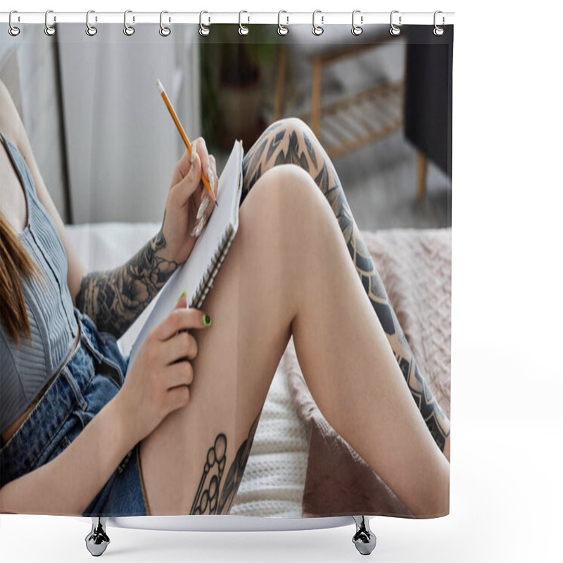 Personality  A Young Woman With Tattoos Sits On A Bed In A Modern Apartment, Writing In A Notebook. Shower Curtains