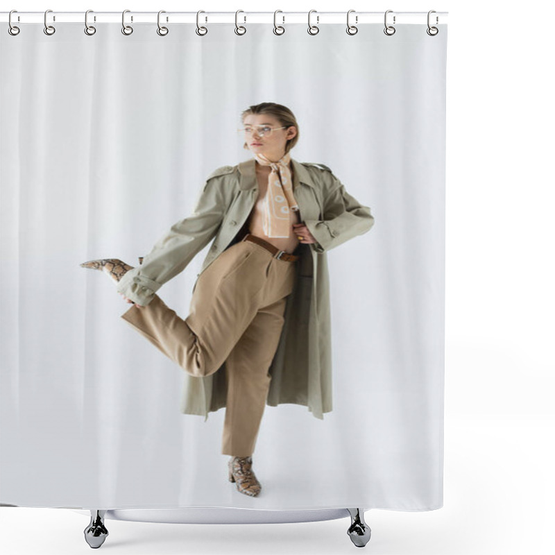 Personality  Full Length Of Trendy Woman In Glasses, Trench Coat And Scarf Posing On White Shower Curtains