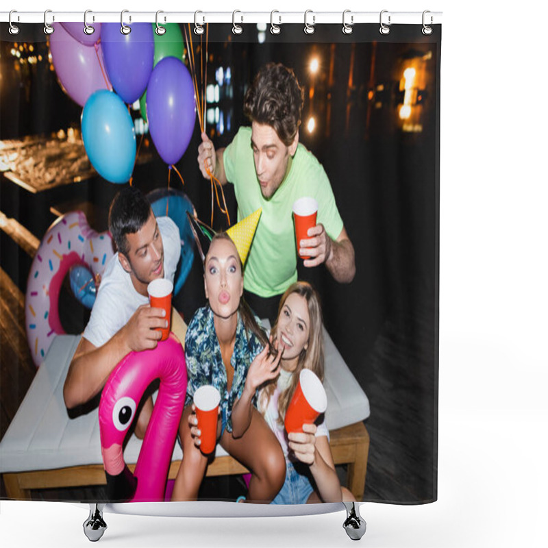 Personality  Young Woman In Party Cap Looking At Camera Near Friends With Disposable Cups And Balloons At Night  Shower Curtains