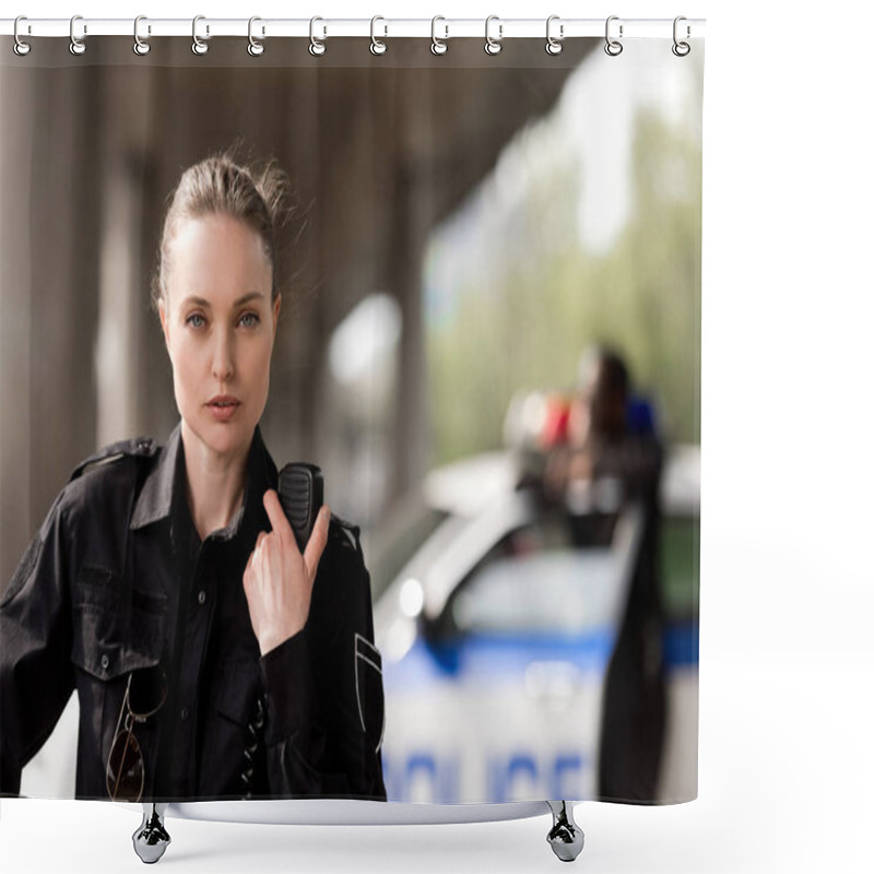 Personality  Policewoman Using Walkie-talkie And Looking At Camera With Blurred Partner Near Car On Background Shower Curtains