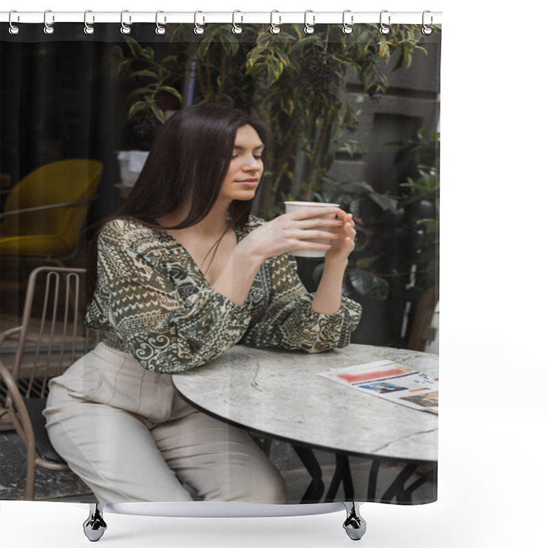 Personality  Alluring Woman With Long Brunette Hair And Makeup Sitting On Chair Near Round Bistro Table With Newspaper And Holding Paper Cup With Coffee Near Blurred Plants On Terrace Of Cafe In Istanbul  Shower Curtains