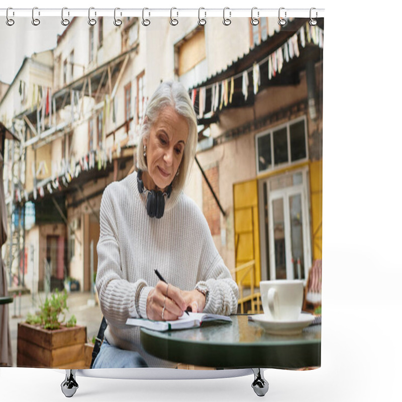 Personality  The Beautiful Gray Haired Woman Sits At A Table, Writing Attentively In A Lively Courtyard. Shower Curtains