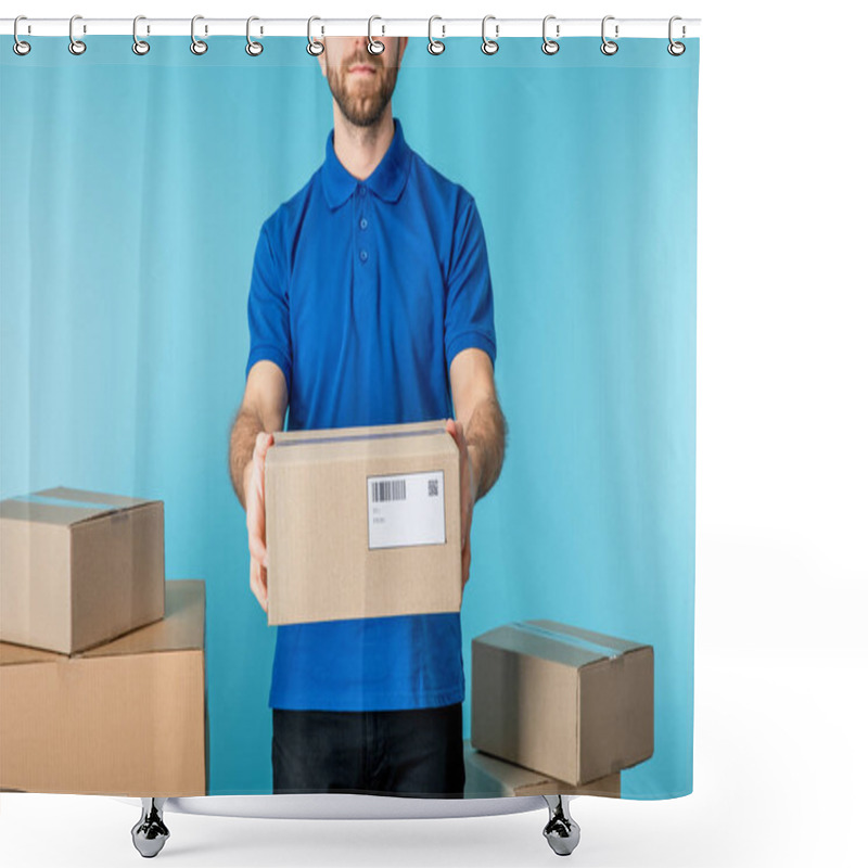 Personality  Cropped View Of Courier Holding Cardboard Package Near Boxes Isolated On Blue Shower Curtains