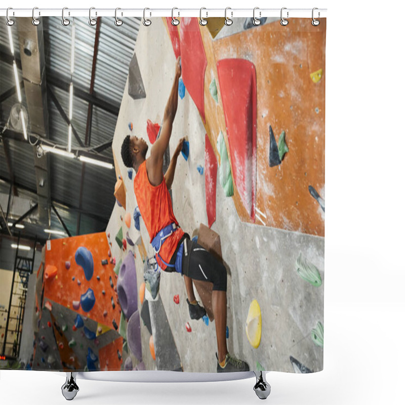 Personality  Handsome African American Man In Orange Shirt Posing In Profile While Climbing Up Rock Wall Shower Curtains