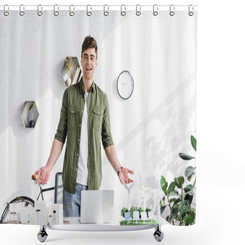 Personality  Handsome Architect Standing And Smiling Near Table With Trees, Buildings And Windmills Models On Grass In Office Shower Curtains