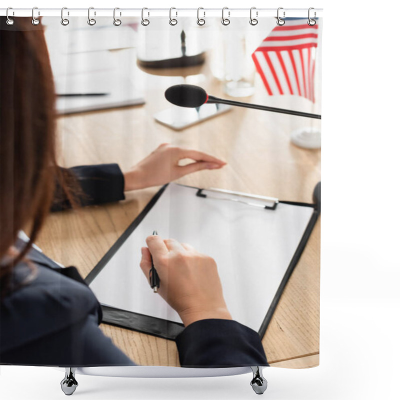 Personality  Cropped View Of Brunette Woman Holding Pen Sitting Near Clipboard With Blank Paper And Microphone On Blurred Background Shower Curtains