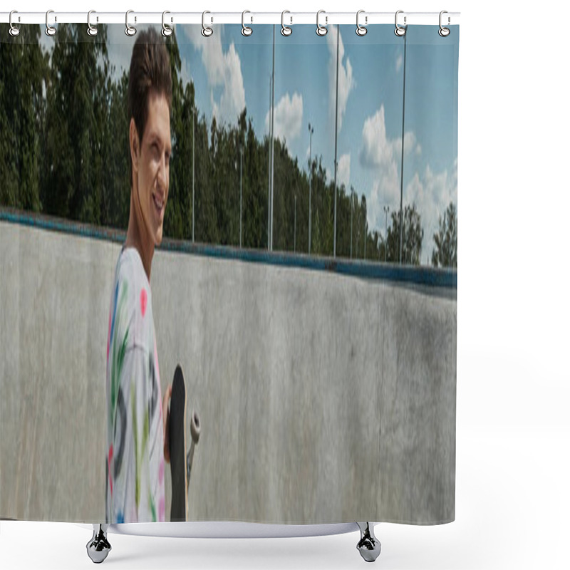 Personality  A Youthful Man Adorned In A Vibrant Shirt Joyfully Holds A Skateboard In A Bustling Skate Park On A Sunny Day. Shower Curtains