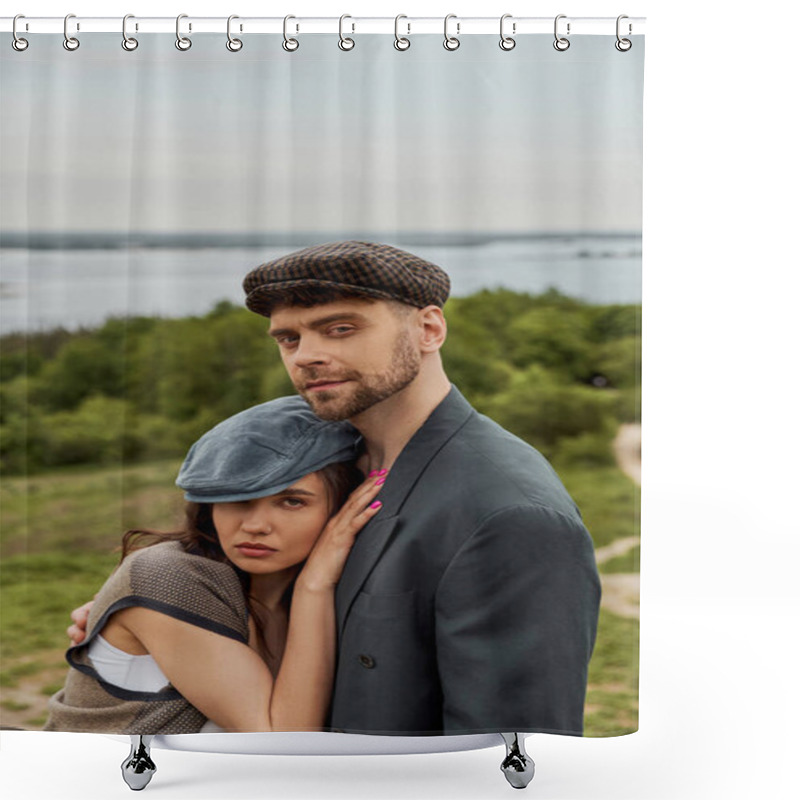 Personality  Portrait Of Confident Bearded Man In Jacket Hugging Brunette Girlfriend In Newsboy Cap And Vest And Looking At Camera While Standing With Landscape At Background, Fashionable Couple In Countryside Shower Curtains