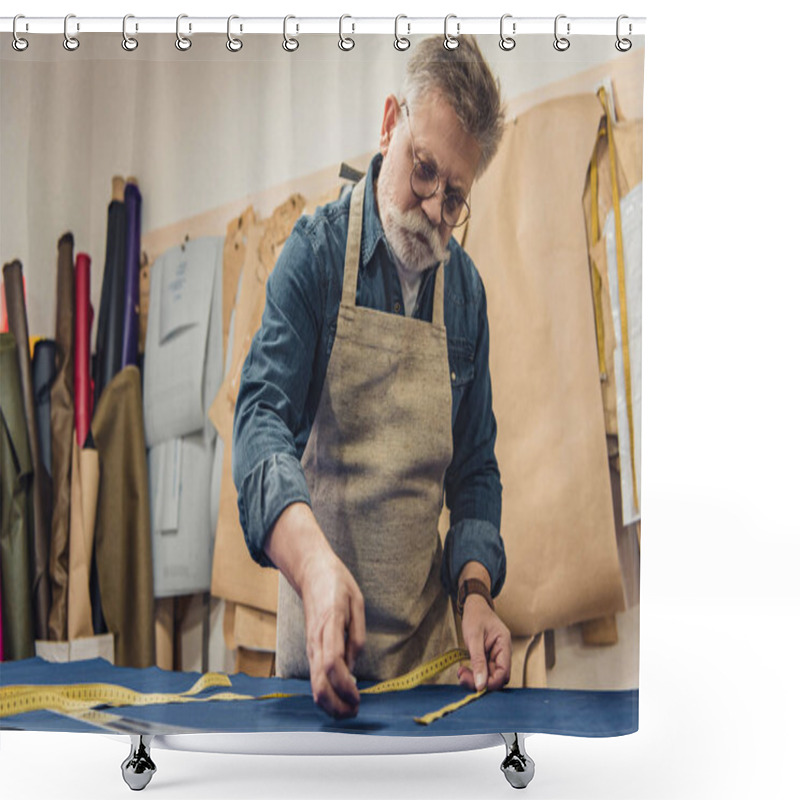 Personality  Selective Focus Of Male Middle Aged Craftsman In Apron Making Measurements On Fabric At Workshop Shower Curtains