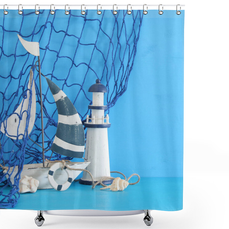 Personality  Nautical Concept With White Decorative Sail Boat, Lighthouse, Seashells And Fishnet Over Blue Wooden Table And Background. Shower Curtains