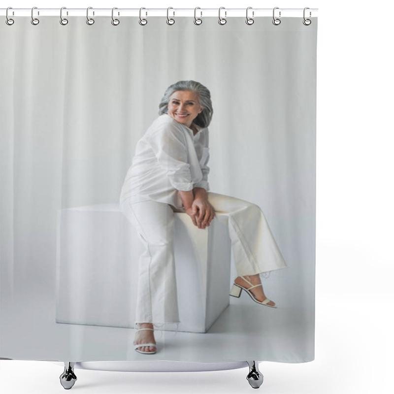 Personality  Smiling Mature Woman Sitting On White Cube On Grey Background  Shower Curtains