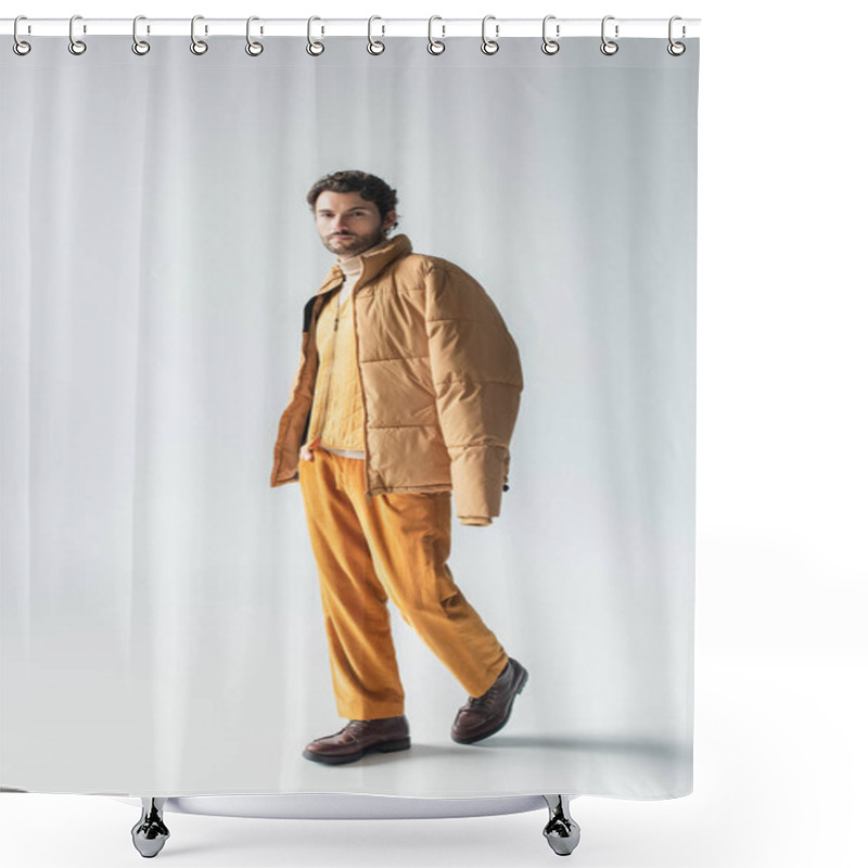 Personality  Full Length View Of Man In Warm Puffer Jacket And Yellow Trousers Posing With Hand In Pocket On Grey Shower Curtains