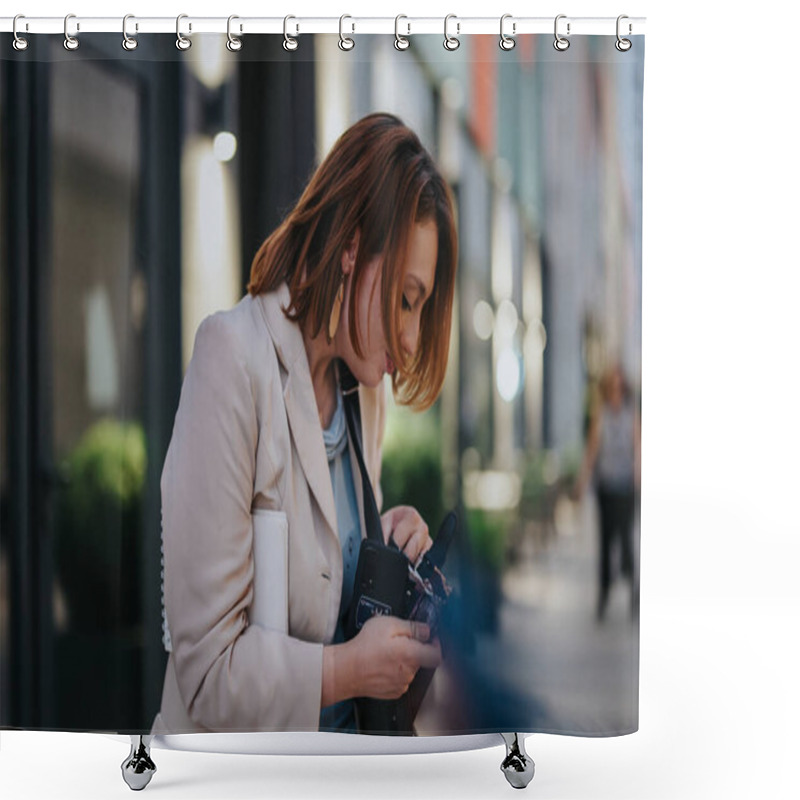 Personality  A Professional Woman Examines A Camera On A Busy City Street, Dressed In A Smart Blazer, Highlighting Urban Lifestyle And Modern Technology. Shower Curtains