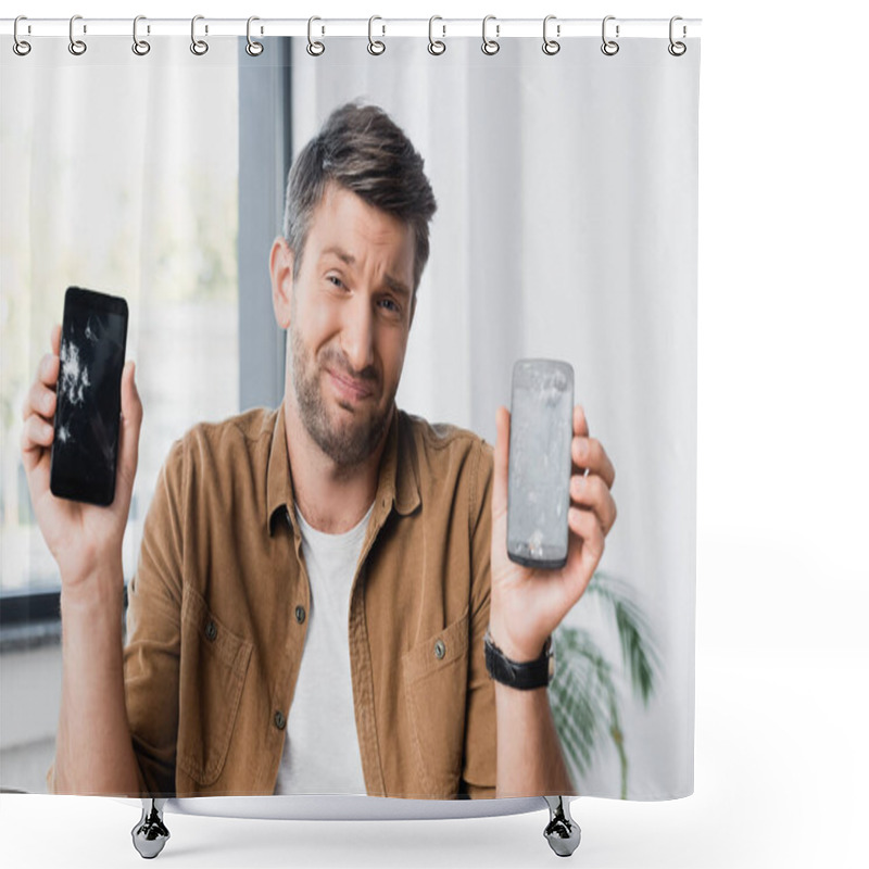 Personality  Confused Businessman With Shrug Gesture Looking At Camera While Holding Smashed Smartphones On Blurred Background Shower Curtains