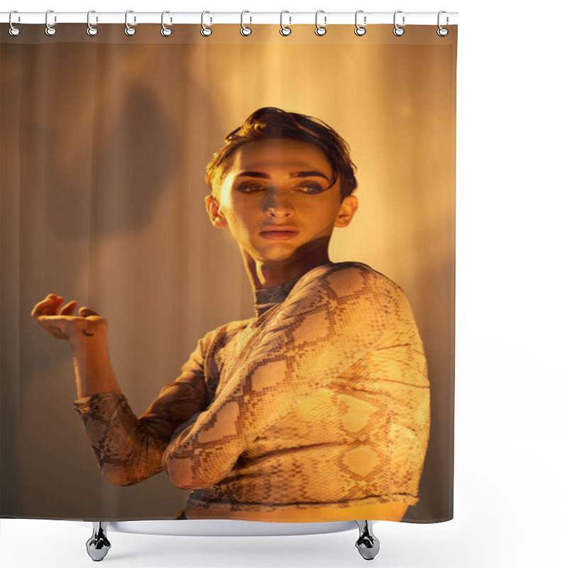 Personality  A Young Queer Person In A Snakeskin Top Strikes A Pose In Front Of A Bright Light, Exuding Style And Confidence. Shower Curtains