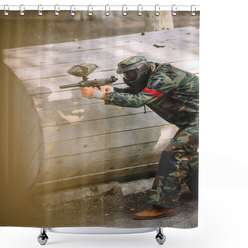 Personality  Side View Of Focused Paintball Player In Goggle Mask And Camouflage Aiming By Paintball Gun Outdoors  Shower Curtains