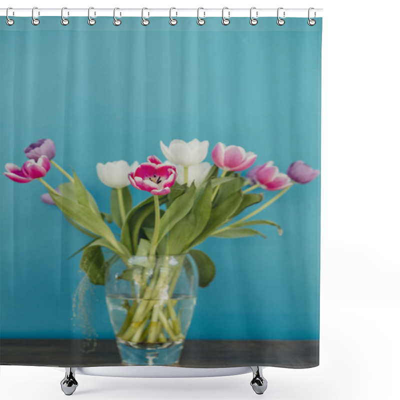 Personality  Vase Of Tulips On Top Of A Side Table. The Colourful Flowers Are Infront Of A Bold Coloured Teal Wall.  Shower Curtains