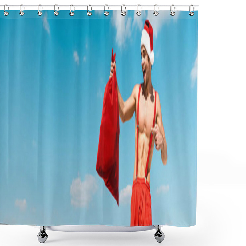 Personality  Panoramic Shot Of Handsome And Sexy Man In Santa Hat Pointing With Finger At Santa Sack On Beach In Maldives  Shower Curtains