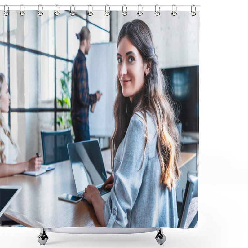 Personality  Young Businesswoman Using Laptop And Smiling At Camera While Working With Colleagues In Office Shower Curtains