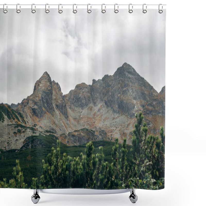 Personality  A Scenic View Of Rugged Mountains Under A Cloudy Sky, With Green Pine Trees In The Foreground. The Mountains Display Rocky Textures And Earthy Tones, Creating A Dramatic Landscape. Shower Curtains