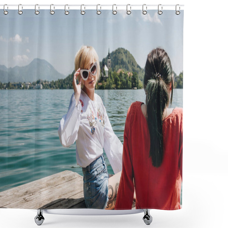 Personality  Beautiful Girl In Sunglasses Looking At Camera While Sitting With Girlfriend On Wooden Pier At Mountain Lake, Bled, Slovenia Shower Curtains