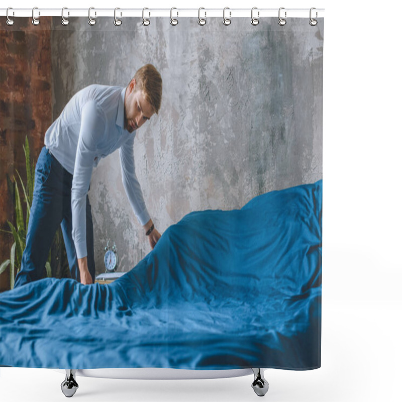 Personality  young businessman making bed in bedroom at home  shower curtains