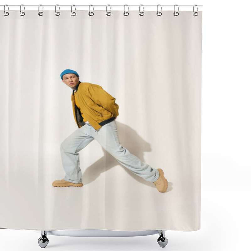 Personality  A Young Man Wearing A Yellow Jacket And Blue Beanie Poses Dynamically In A Stylish Outfit. Shower Curtains