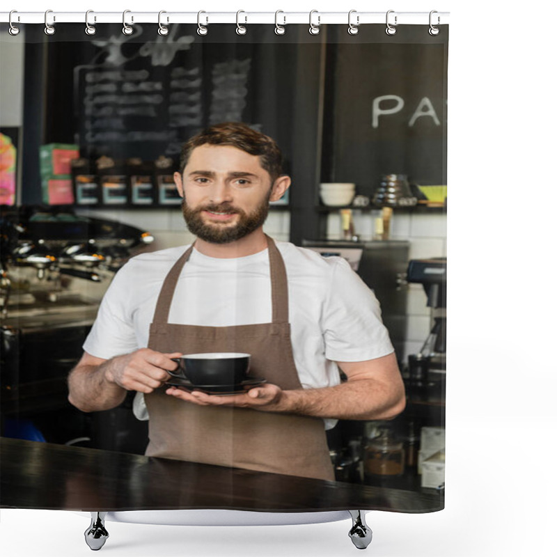 Personality  Smiling Bearded Barista In Apron Holding Cup Of Coffee And Looking At Camera In Coffee Shop Shower Curtains