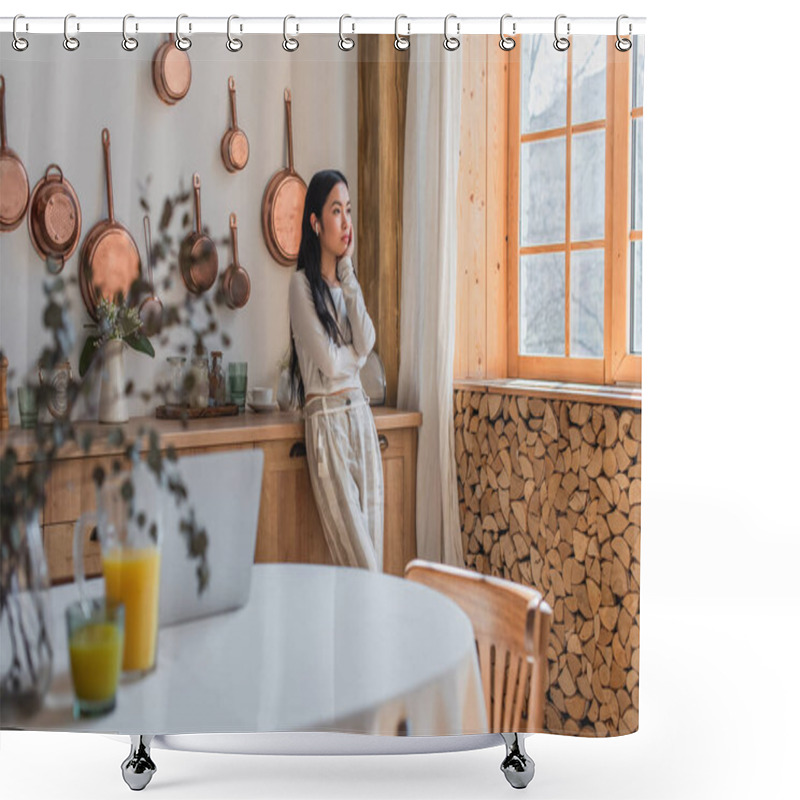 Personality  Thoughtful Young Asian Woman In Blouse And Trousers Standing With Earphones And Holding Hand Near Face In Kitchen Shower Curtains