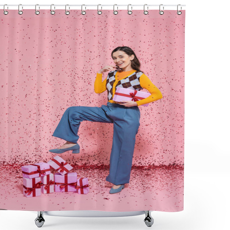 Personality  Joyful Woman In Blue Pants Holding Gift Box While Posing Near Pile Of Presents And Confetti On Pink Background Shower Curtains