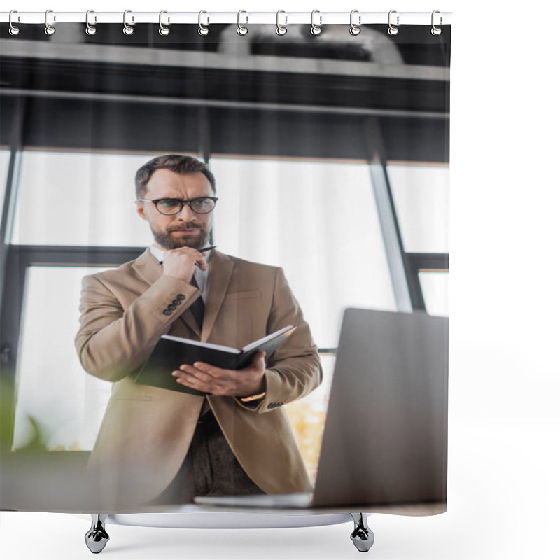 Personality  Low Angle View Of Thoughtful Businessman In Eyeglasses And Stylish Blazer Standing With Notebook And Pen And Looking At Laptop In Office On Blurred Foreground Shower Curtains