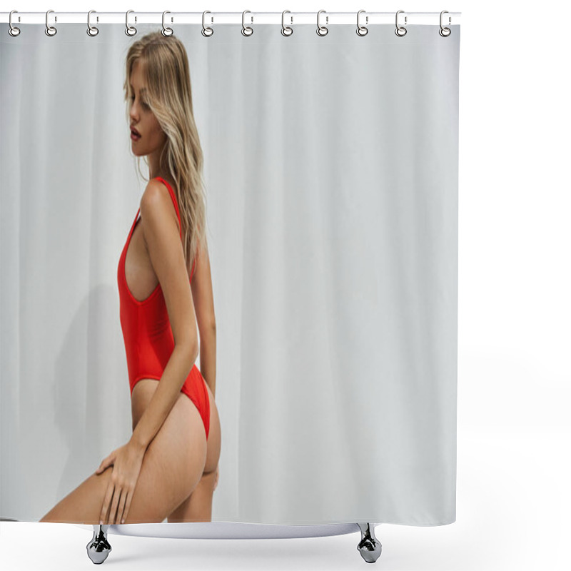 Personality  A Young Blonde Woman Poses In A Red Swimsuit Against A Plain Grey Background. Shower Curtains