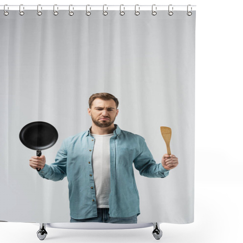 Personality  Displeased Young Man With Frying Pan And Spatula Isolated On Grey Shower Curtains