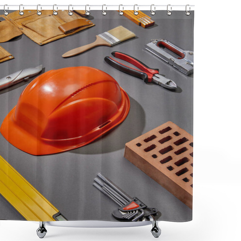 Personality  Flat Lay With Orange Helmet, Brick, Brush, Brick, Tool Belt And Industrial Tools On Grey Background Shower Curtains