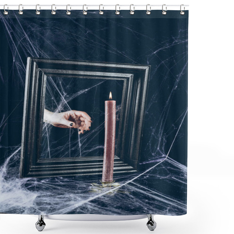 Personality  Cropped View Of Mystic Hand Taking Candle From Mirror Frame With Scary Spider Web Around Shower Curtains