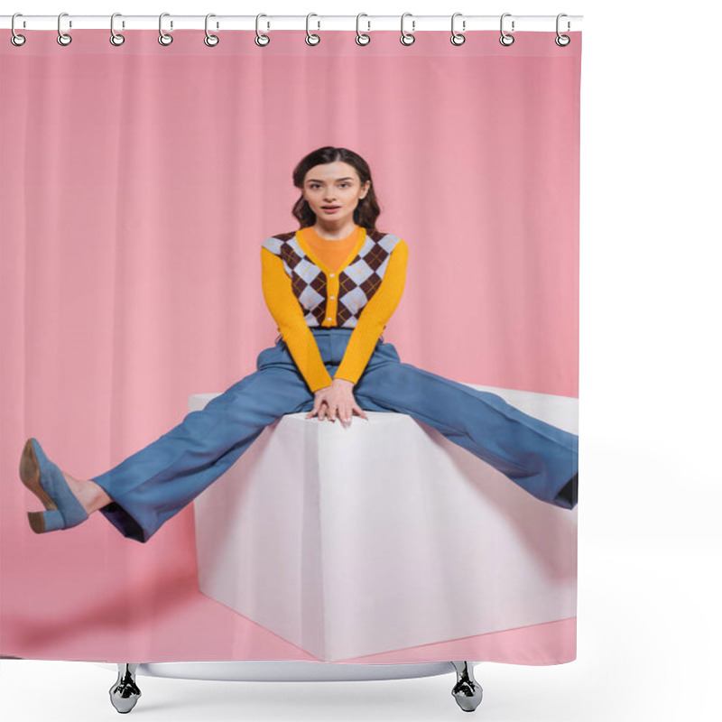 Personality  Full Length Of Young Brunette Woman In Fashionable Outfit Looking At Camera While Sitting On White Cube On Pink Background Shower Curtains