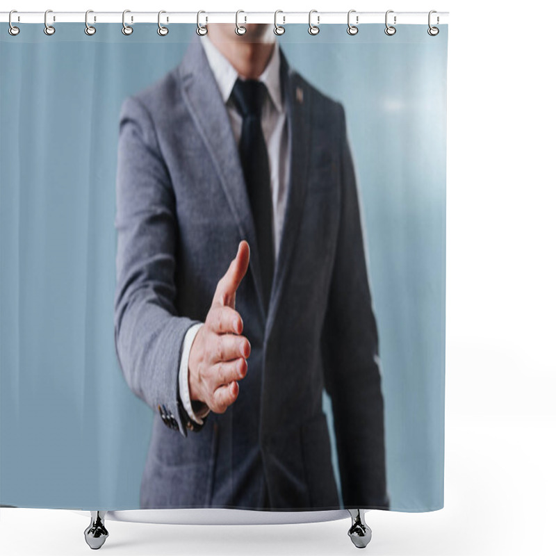 Personality  Businessman In Suit Extending Hand, Ready For Handshake Over Blue Background Shower Curtains