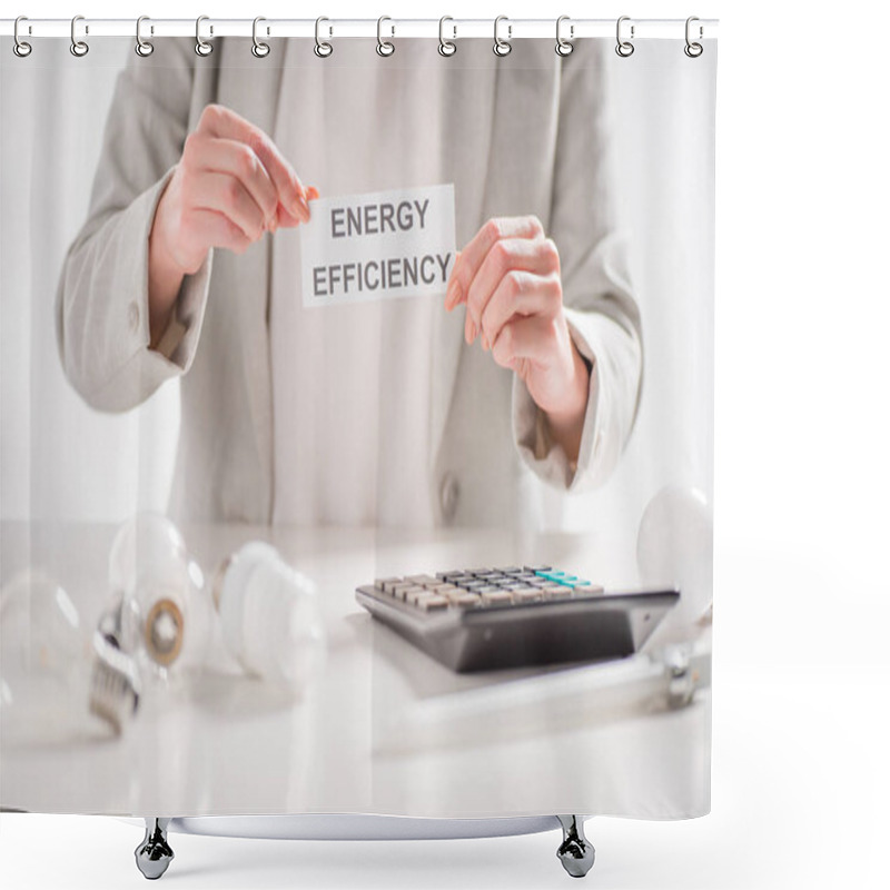 Personality  Cropped View Of Woman Holding Paper Card With Lettering Near Lamps And Calculator On White Background, Energy Efficiency Concept Shower Curtains