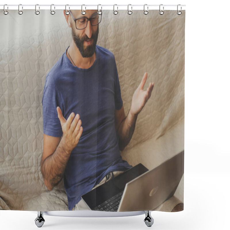 Personality  Smiling Millennial Business Man In Eyeglasses Wearing Wireless Headphones, Holding Video Call With Clients On Laptop, Sitting On Sofa At Home. Online Conference, Webinar, Educational Class Lecture. Shower Curtains