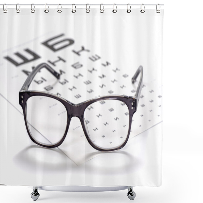 Personality  Reading Eyeglasses And Eye Chart Close-up On A Light Background Shower Curtains