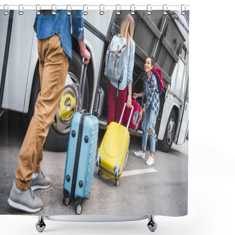 Personality  Selective Focus Of Smiling Woman Putting Wheeled Bag Into Travel Bus While Her Friends Walking Near At Urban Street  Shower Curtains