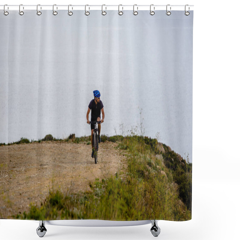 Personality  Theme Tourism And Cycling On Mountain Biking. Guy Rides Uphill On A Rocky, Rocky Road Against The Background Of The Mediterranean Sea In Spain On The Shore Of The Kosta Brava In Helmet And Sportswear Shower Curtains